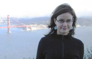 smiling woman with Golden Gate Bridge in background