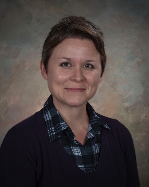 head shot of smiling woman