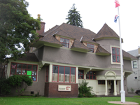 large house with sign